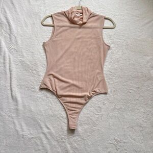Cotton Candy Sleeveless Turtleneck Bodysuit in Blush Pink